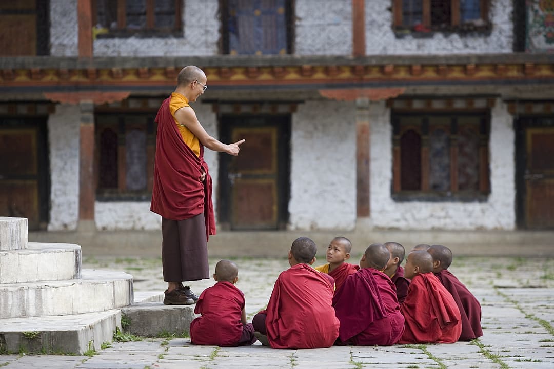 Buddhist monks at The Karchu Dratsang Monastery in Paro Valley, Bhutan.