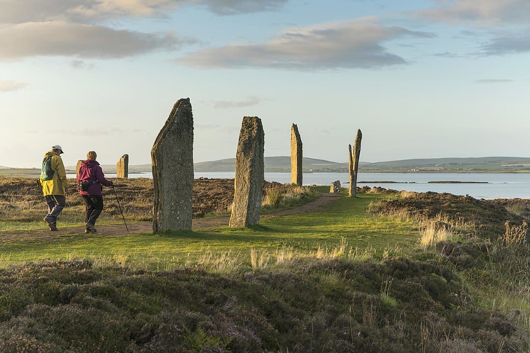 Senior couple hiking at the Ring of Brodger in Orkeny, Scotland