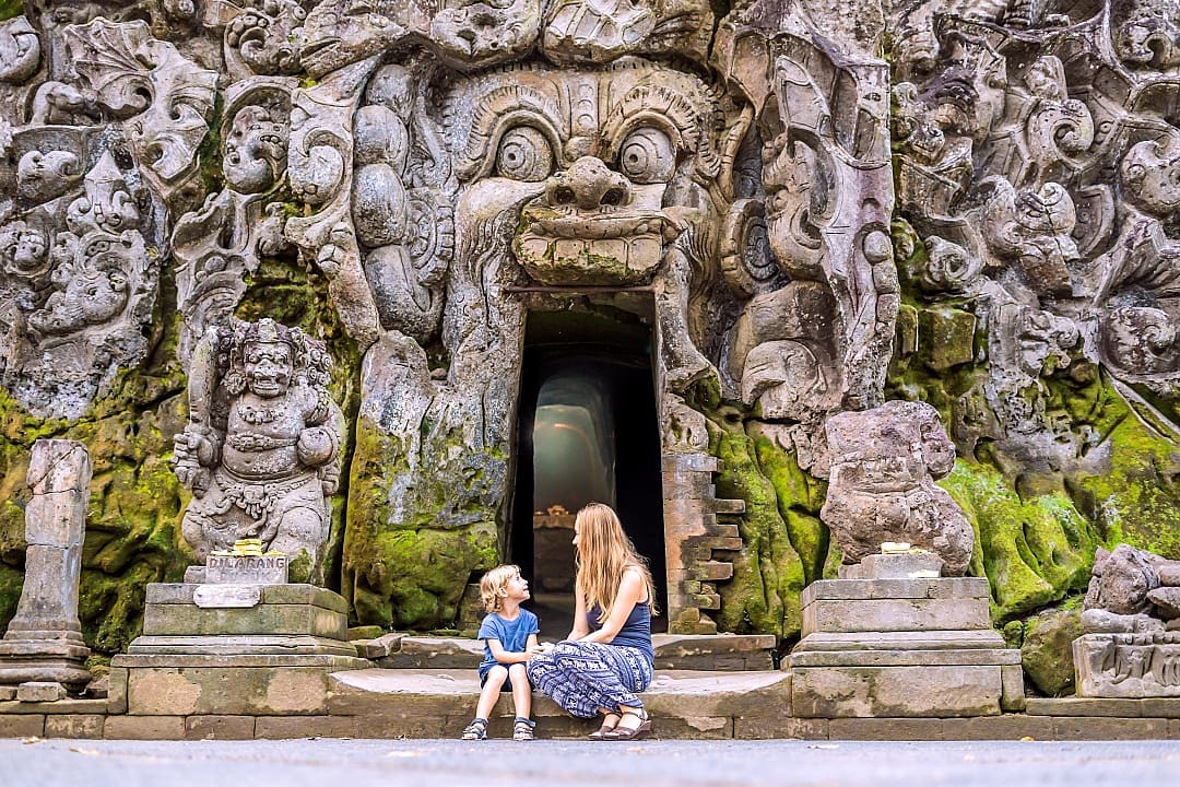 Mother and son at Goa Gajah temple in Bali 