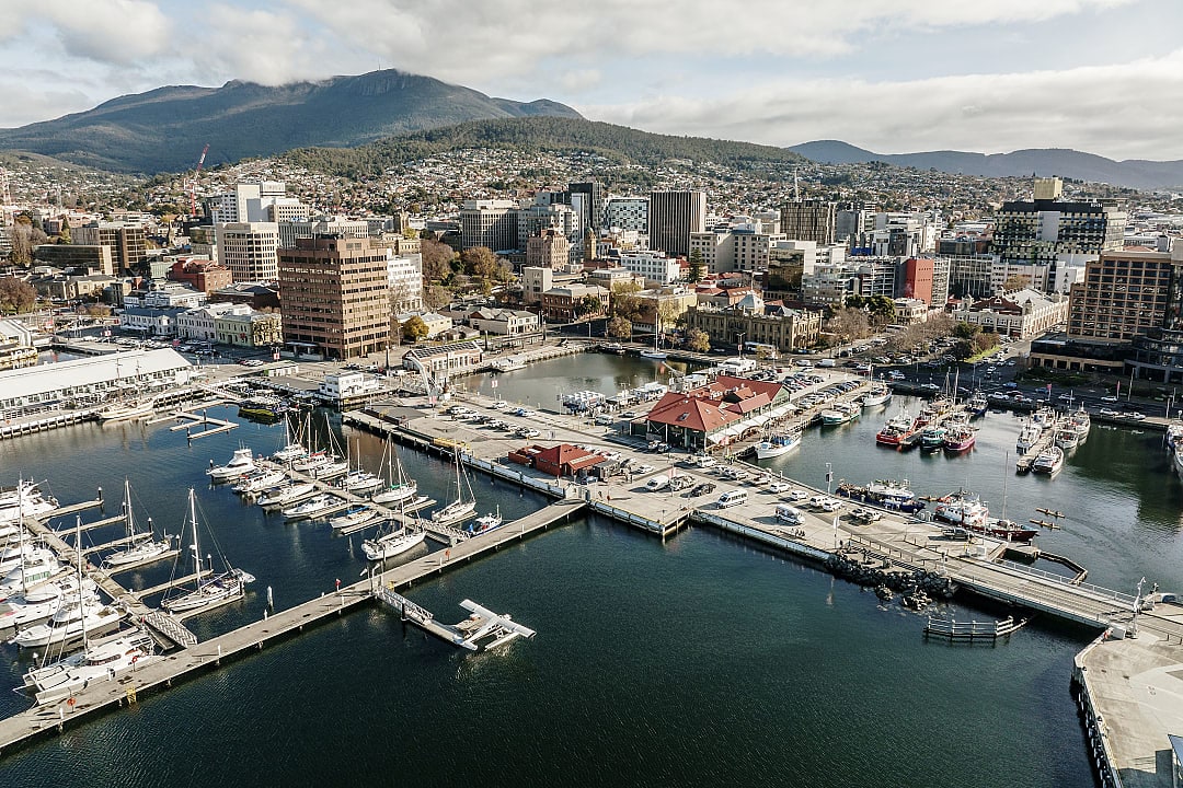Aerial view of Hobart waterfront and marina with Mount Wellington in the background, Tasmania