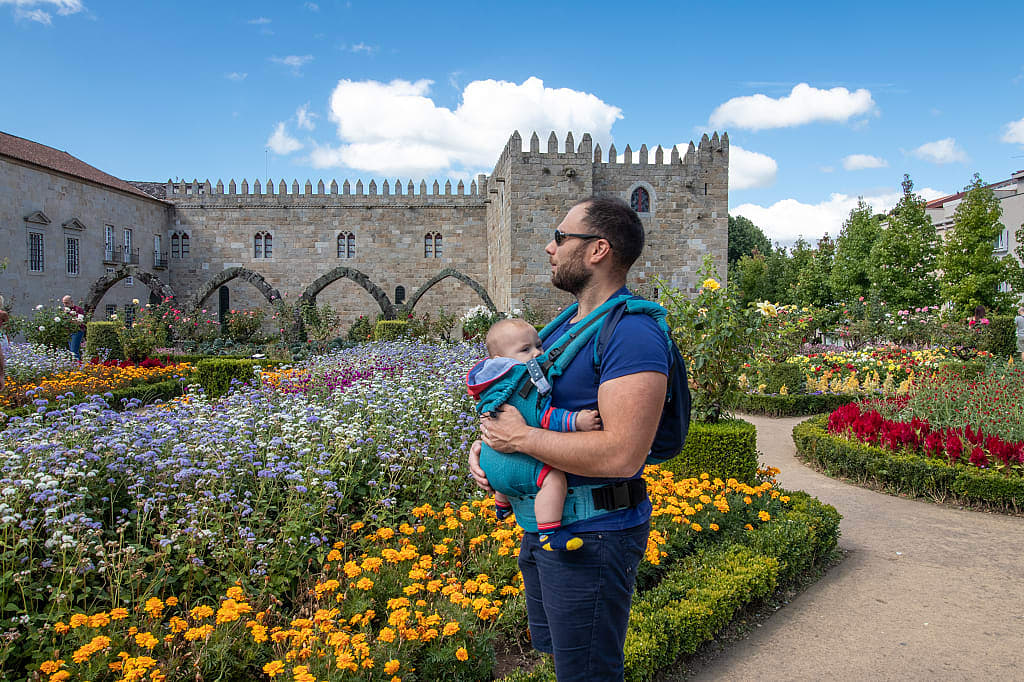 Father with baby visiting the Garden of Santa Barbara in Braga, Portugal
