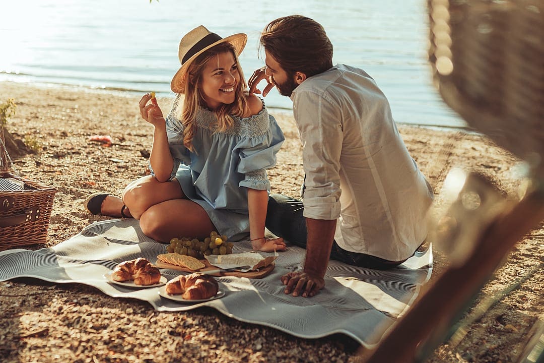 Couple on a romantic bike ride and picnic