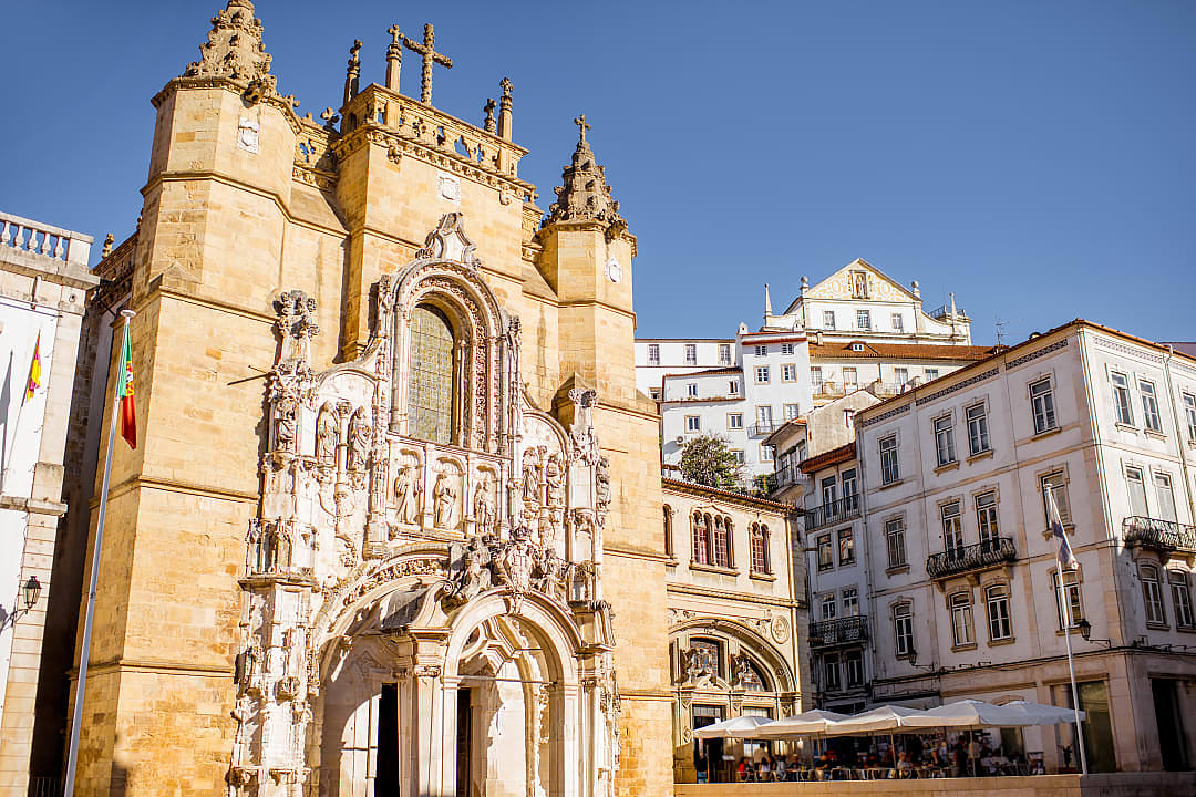 Gothic facade of Santa Cruz Monastery in Coimbra, Portugal, on a sunny day
