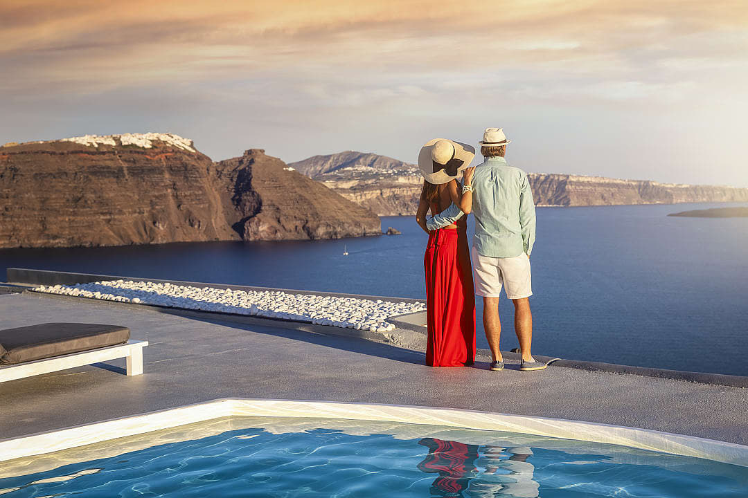 Couple watching the sunset in Santorini, Greece