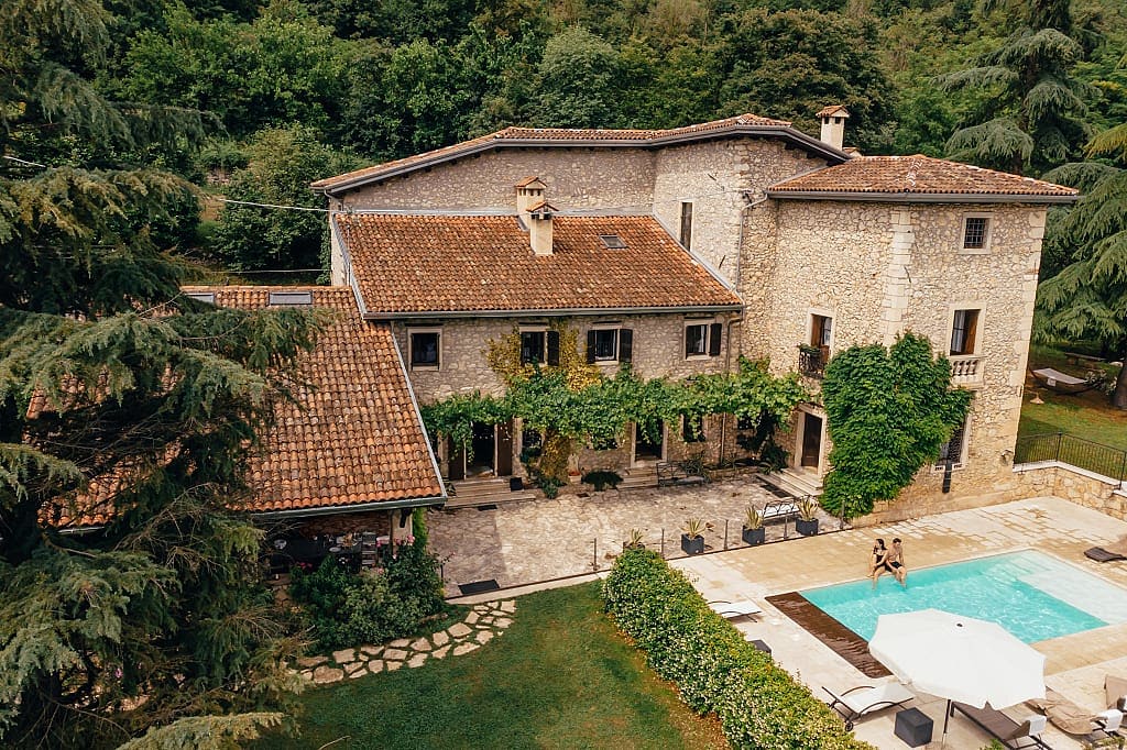 Couple poolside at a villa in Tuscany, Italy