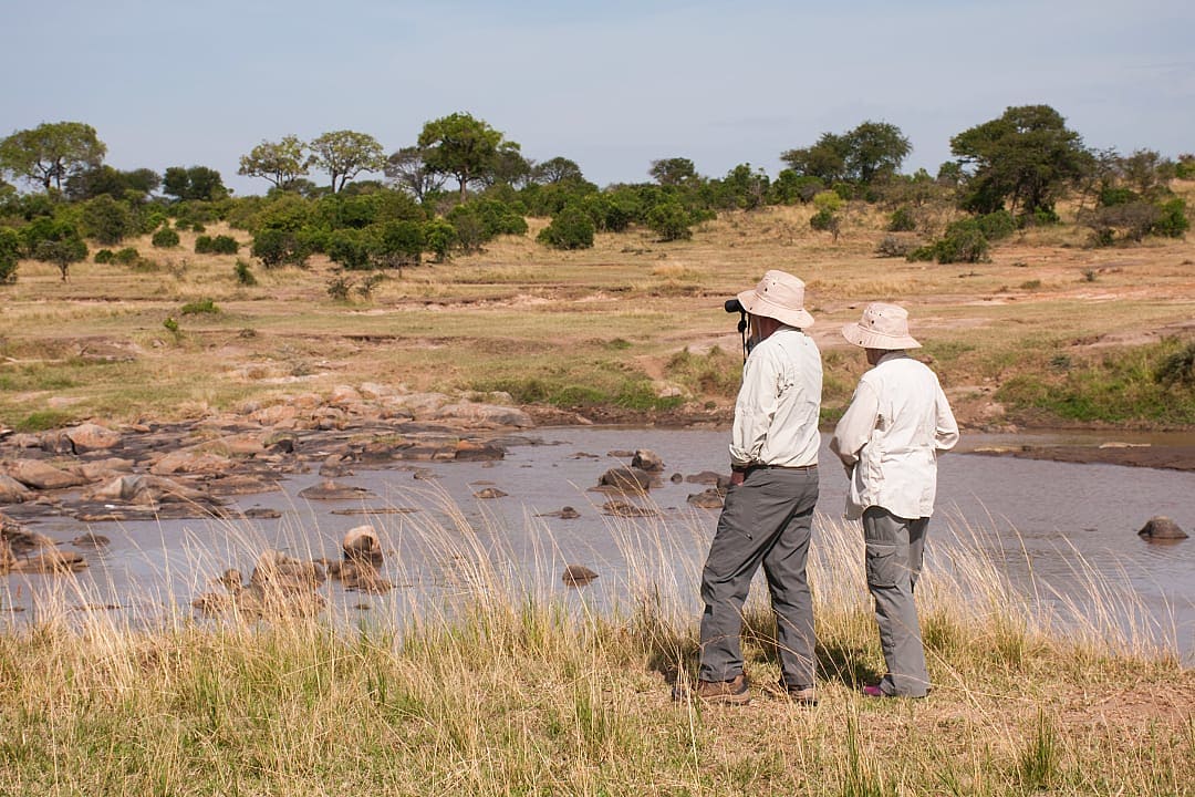 Senior couple dressed in grey and beiges while on safari in africa