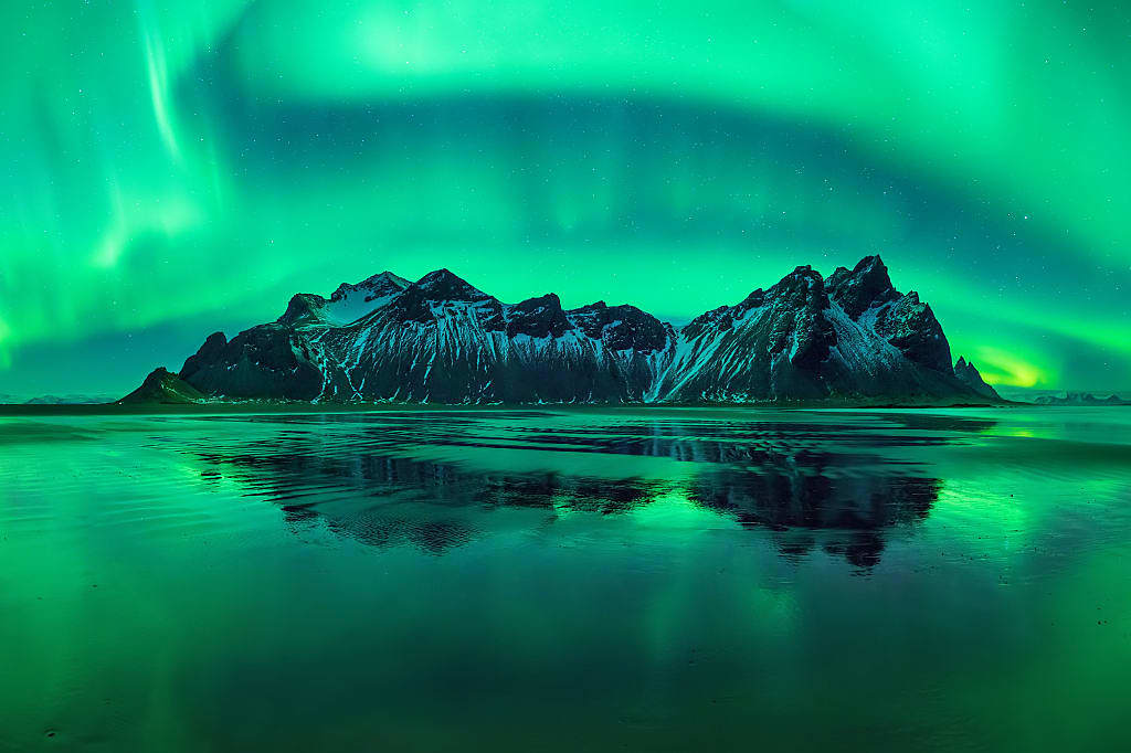 Northern lights over Vestrahorn in Stokksnes, Iceland