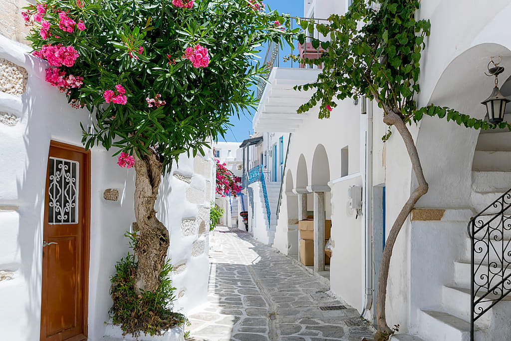 Narrow cobblestone alley way in Santorini, Greece