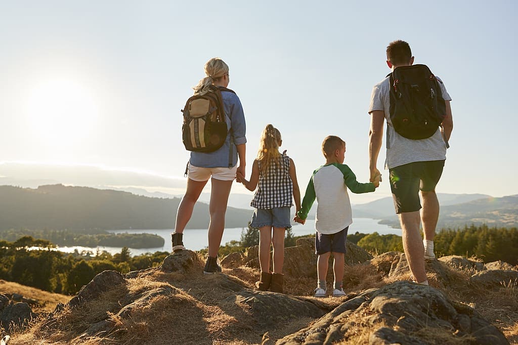Family hiking in the countryside of England