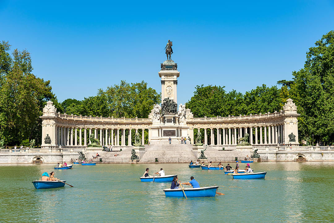 Families enjoying boat rides at El Retiro Park in Madrid, Spain