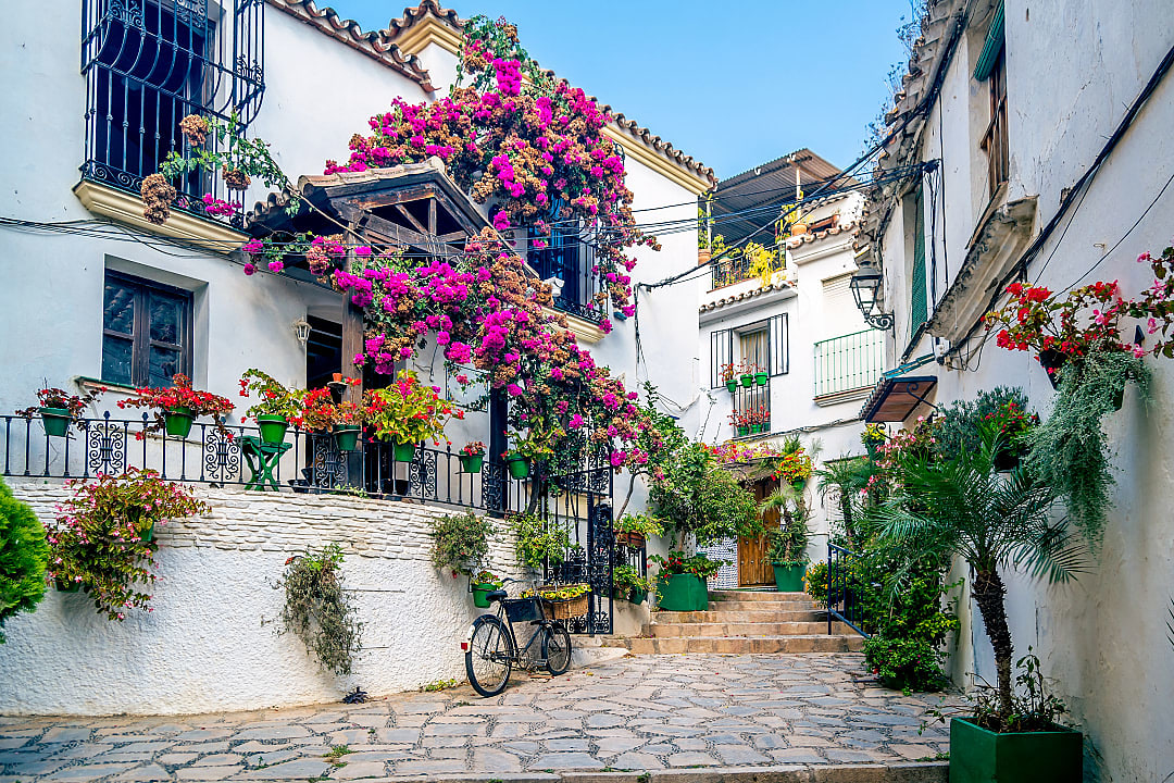 Narrow cobblestone street in Estepona, Spain