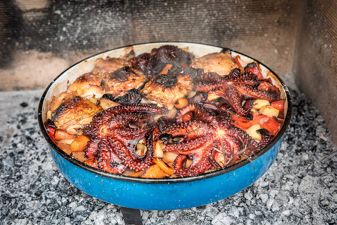 Traditional Peka dish, with Octopus, chicken and vegetables, cooked on an open fire.