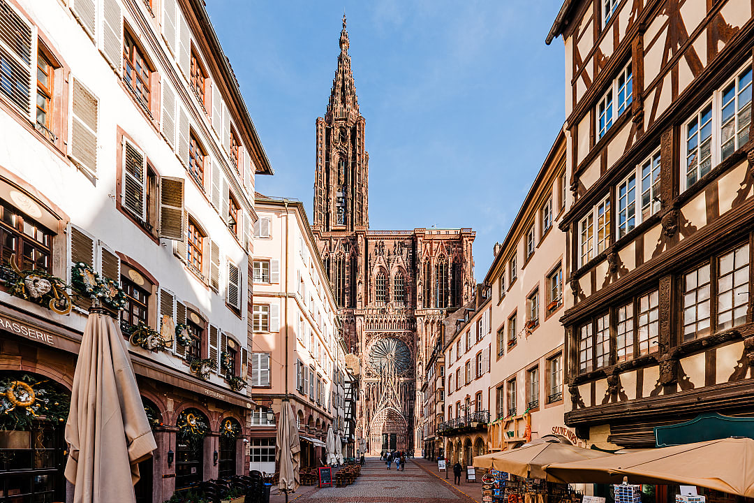 trasbourg Cathedral towering over timber-framed buildings in the historic city center