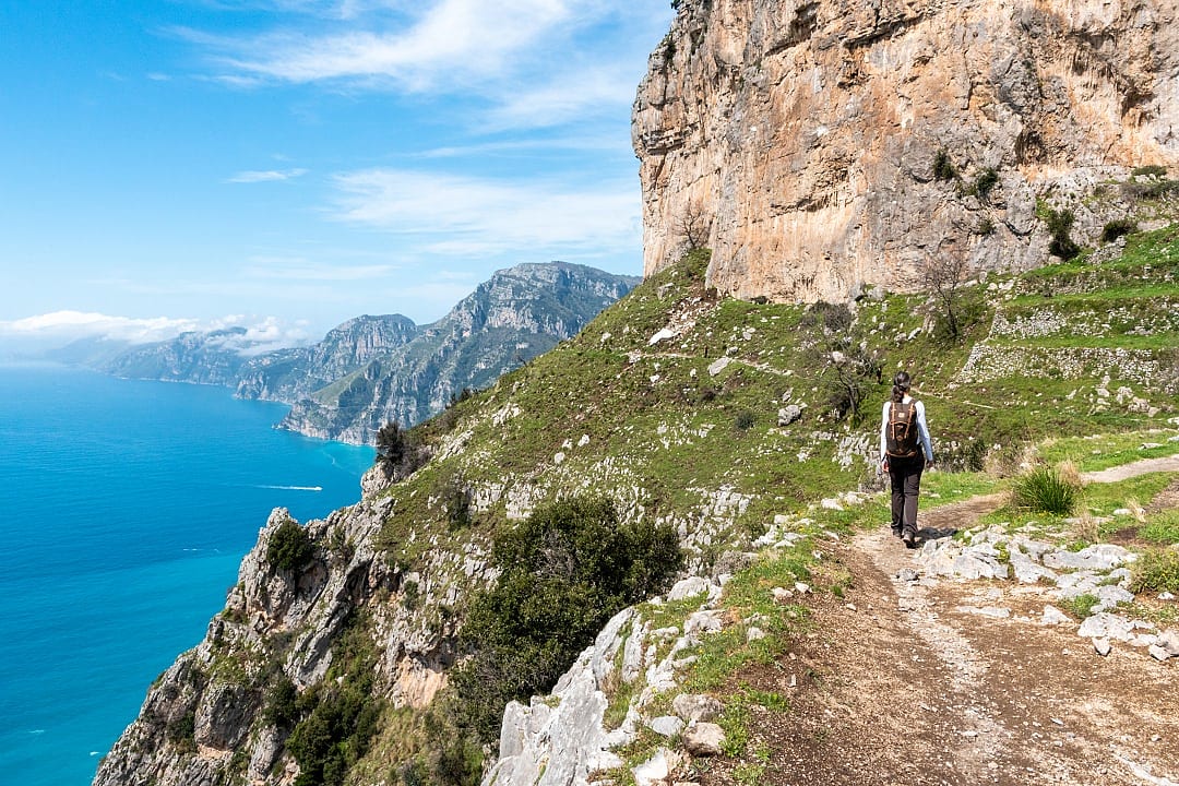 Woman walking The Path of the Gods on the Amalfi Coast, Italy.