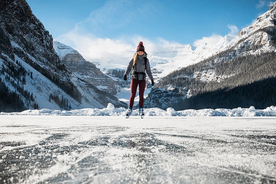 Teenage girl skating at Lake Louise in Banff National Park, Canada