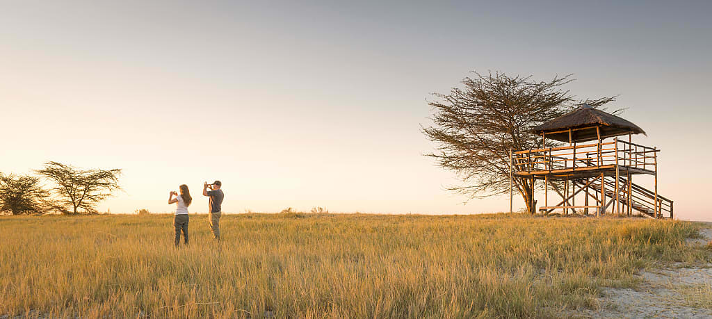 Couple on safari in the Makgadikgadi Pan, Botswana, Africa
