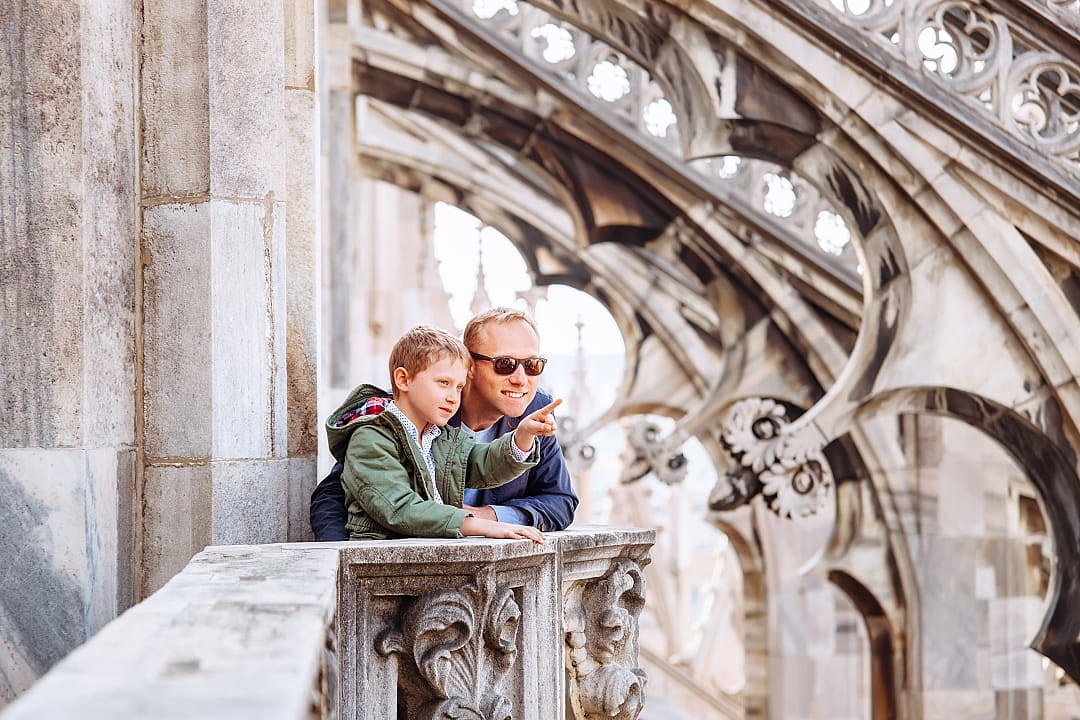 Father and son exploring the Duomo in Milan, Italy