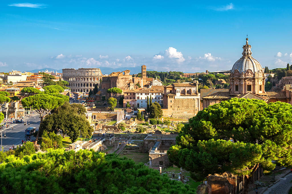 Rooftops of Rome, with the Colosseum in the background.