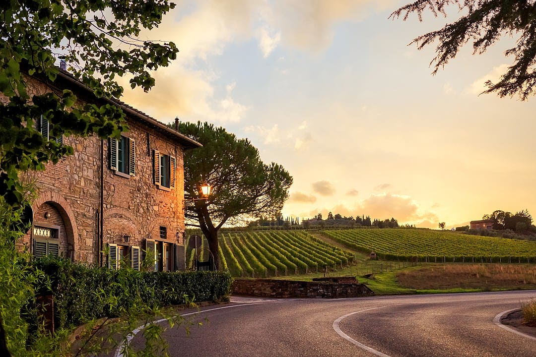 Tuscan countryside farm at sunset