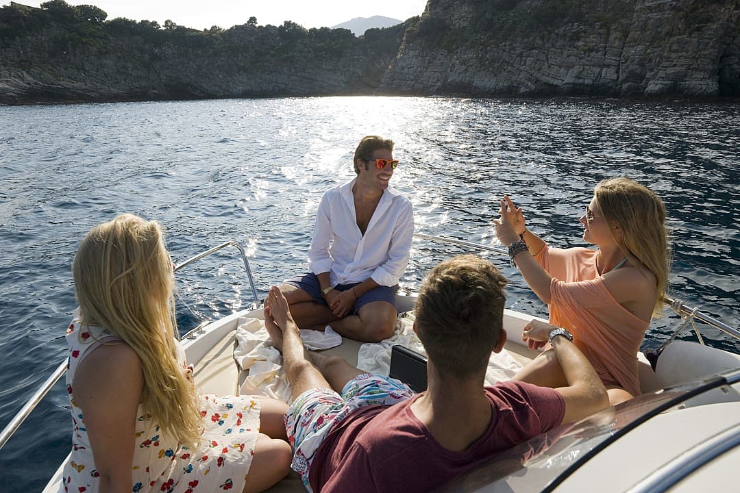 Friends on boat ride on the Mediterranean sea 