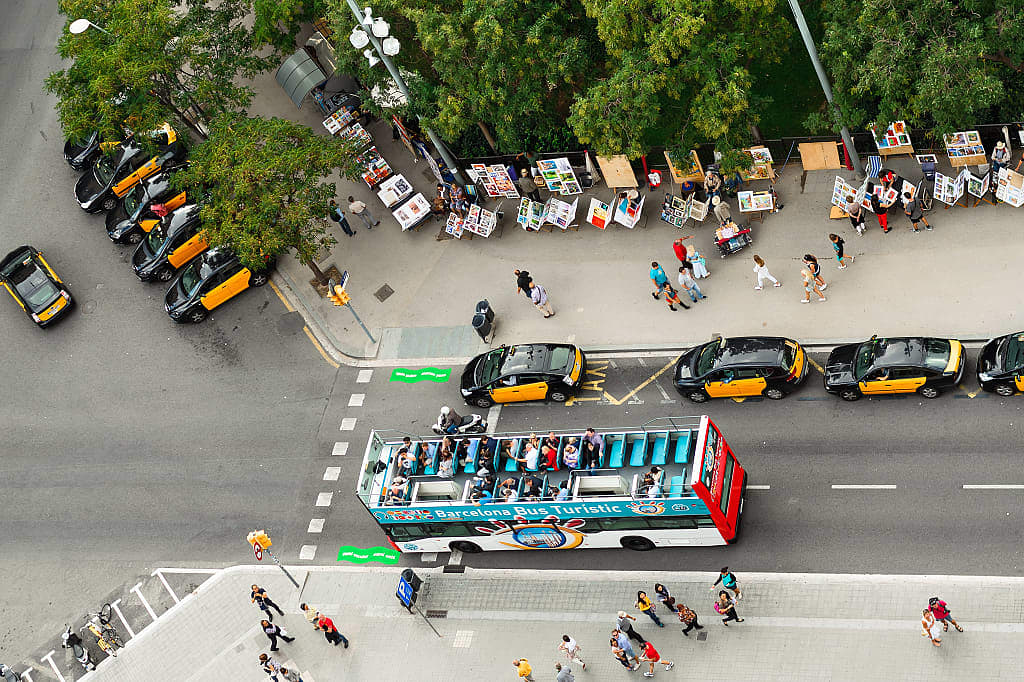 Taxis and tourist bus at Sagrada Familia in Barcelona, Spain.