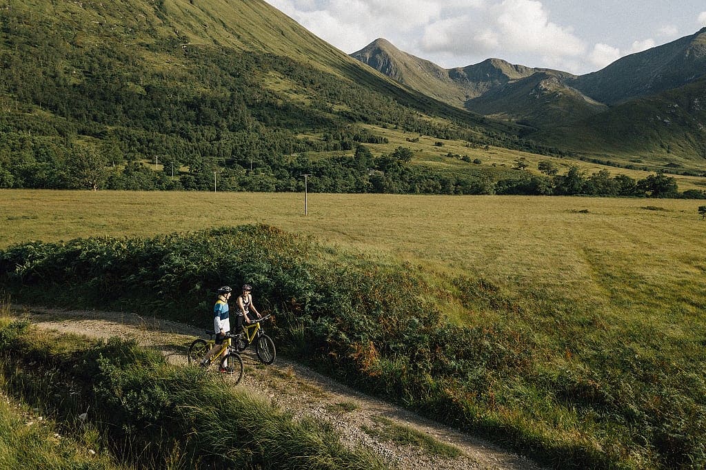 Couple biking in the Scottish Highlands