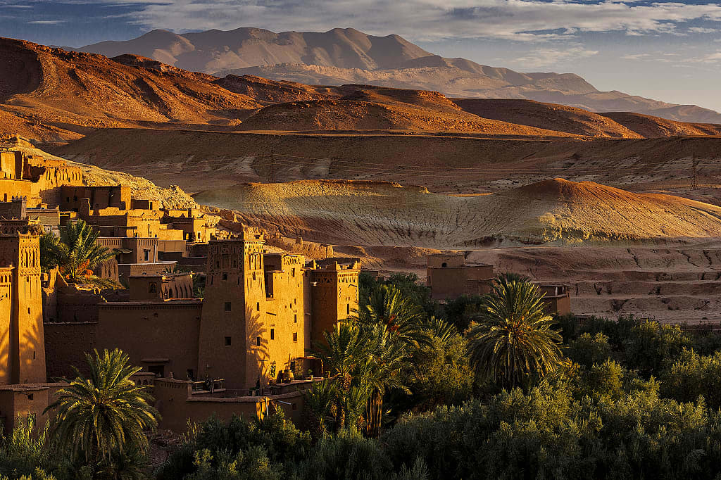 Kasbah of Ait Ben Haddou, among date trees and hills, Morocco