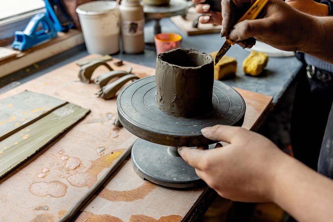 Woman experiencing a pottery class in Ireland. 