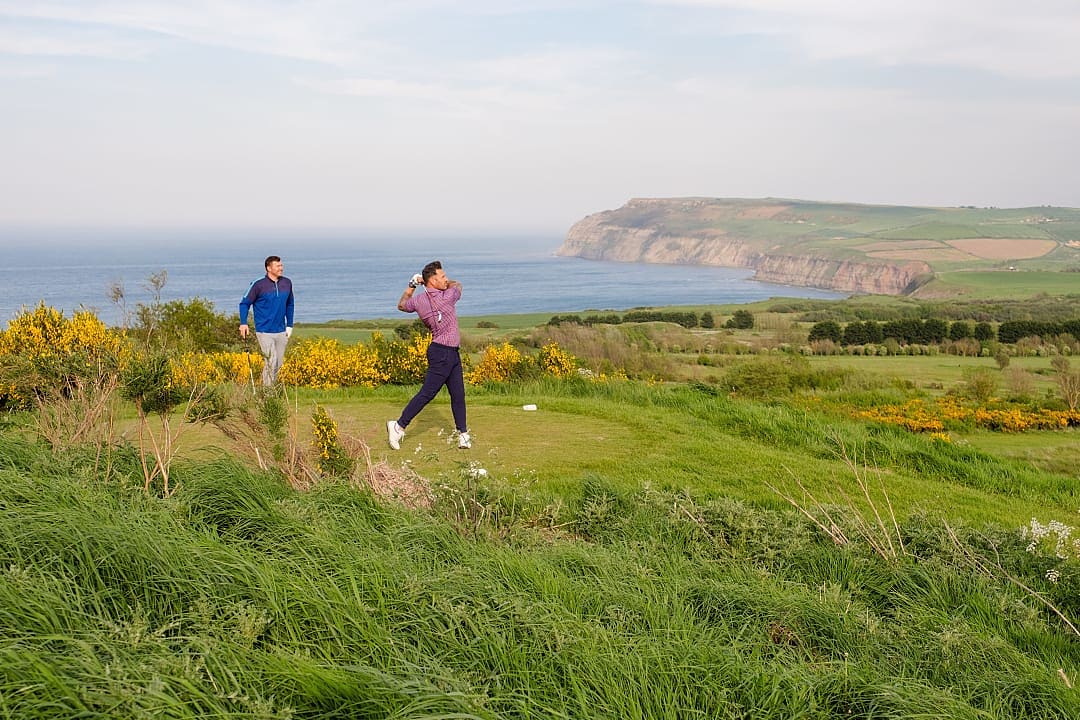 Two men golfing at Hunely Hall Golf Club in North Yorkshire, England