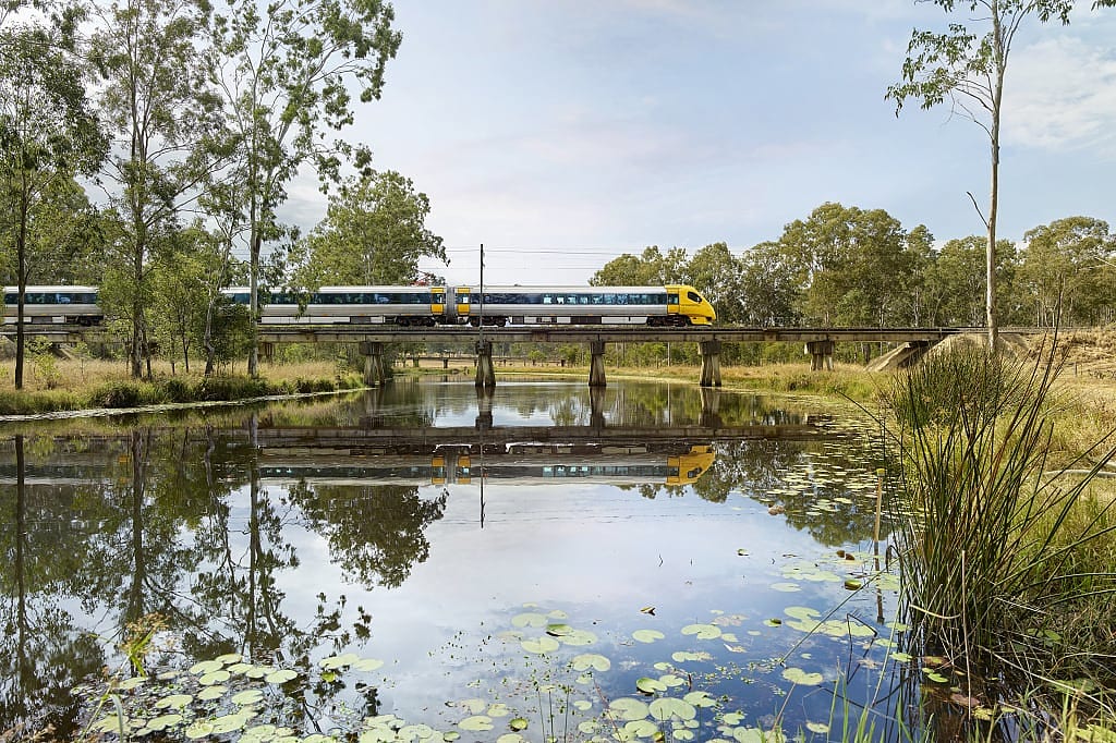 Tilt train traveling over a creek in Queensland 
