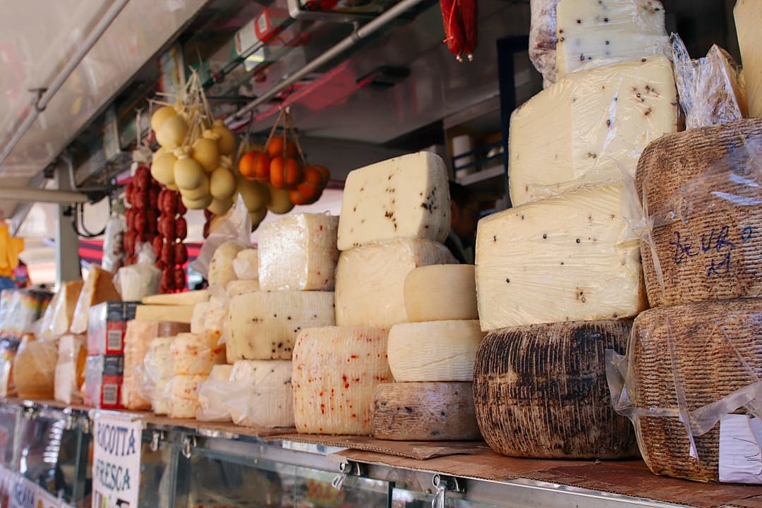 Selection of cheeses for sale at market in Palermo, Sicily