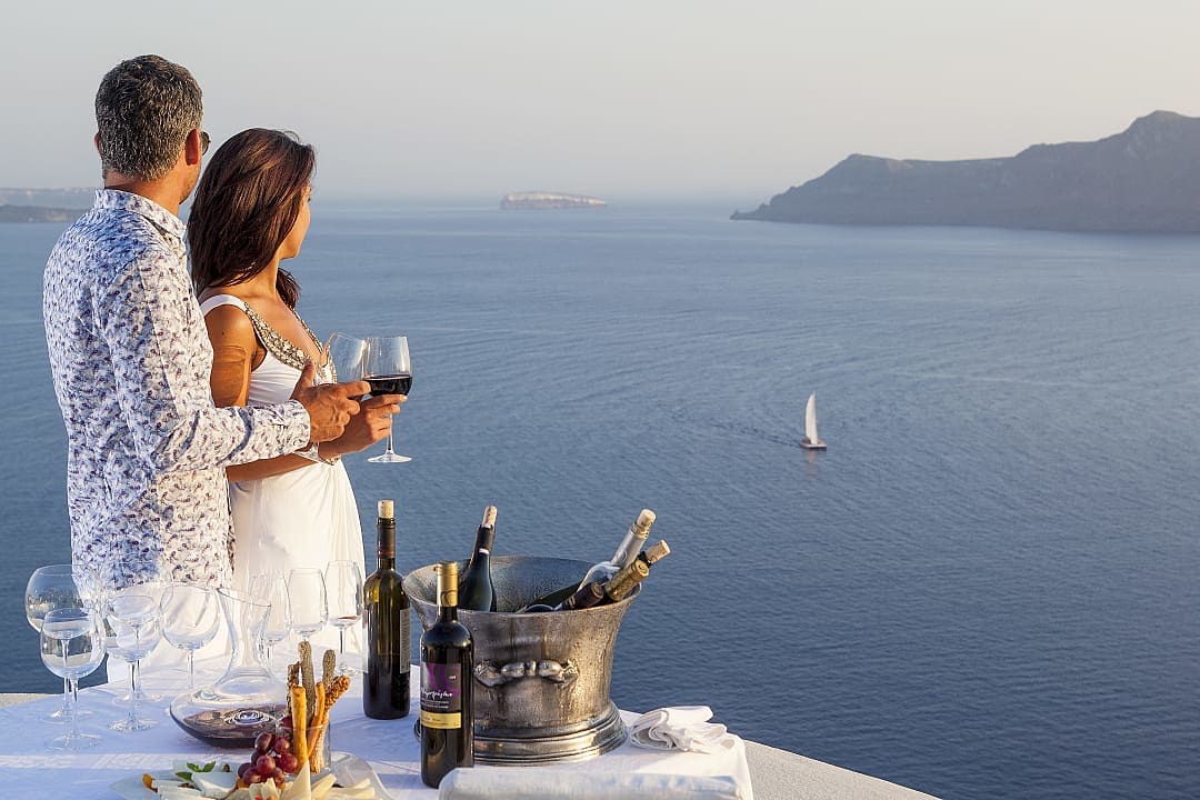 Couple enjoying view in Oia, Santorini, Greece
