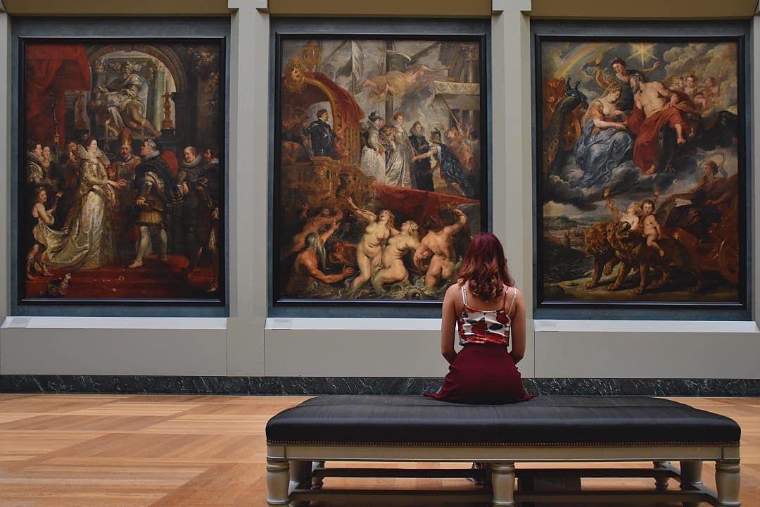 A woman admires art in the Louvre in Paris
