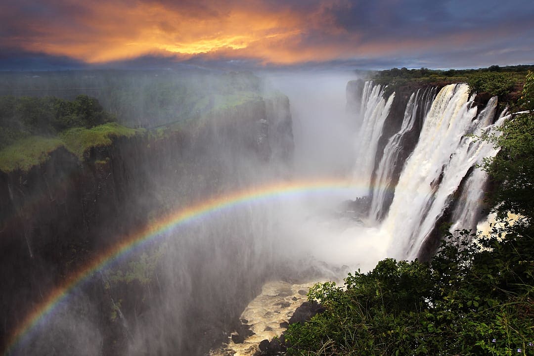 A Lunar Rainbow shining through the mist of Victoria Falls.