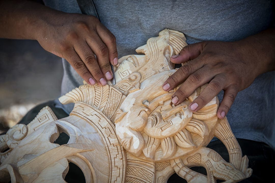 Artisan carving wood