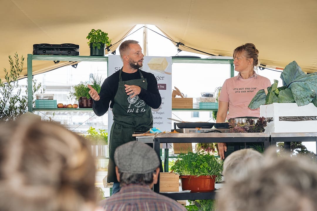 Chef giving a cooking demonstration with fresh produce at Copenhagen Cooking and Food Festival