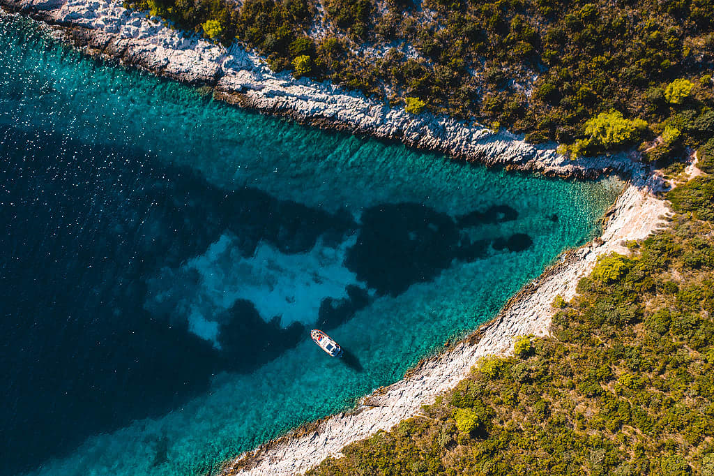 Aerial view of the Burger 105 Motor Yacht anchored in a small cove.