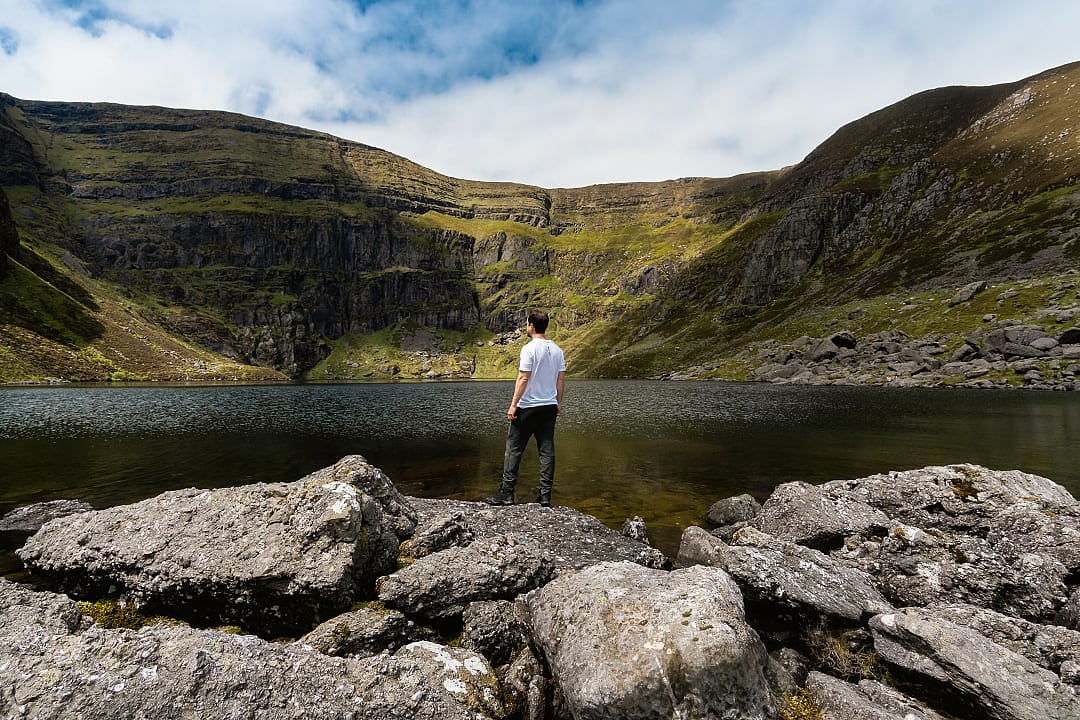 Hiker at Coumshingaun Lough in County Waterford