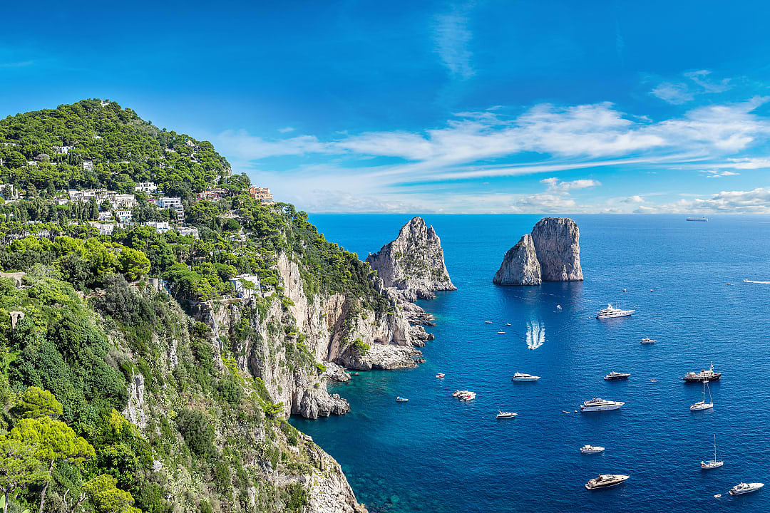 Faraglioni stacks off the coast of Capri island, Italy