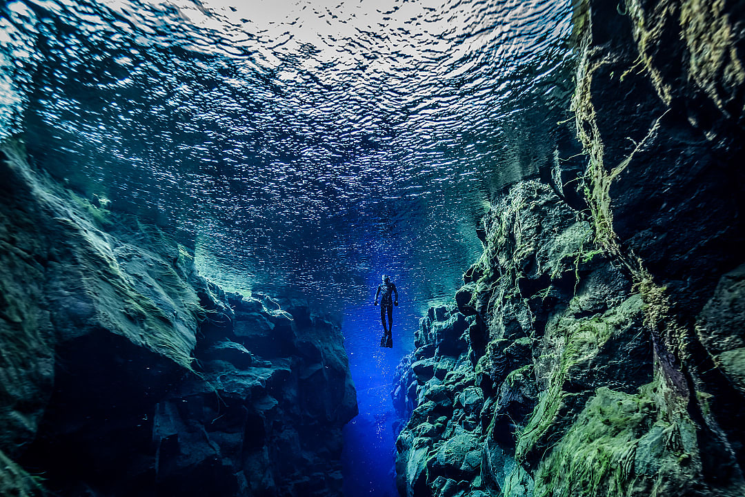 Free diver at Silfra Fissure in Iceland