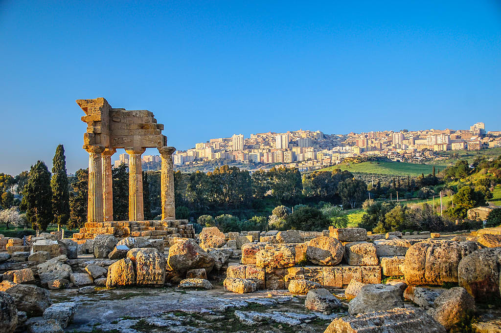 Temple of Castor and Pollux ruins with Agrigento in the background