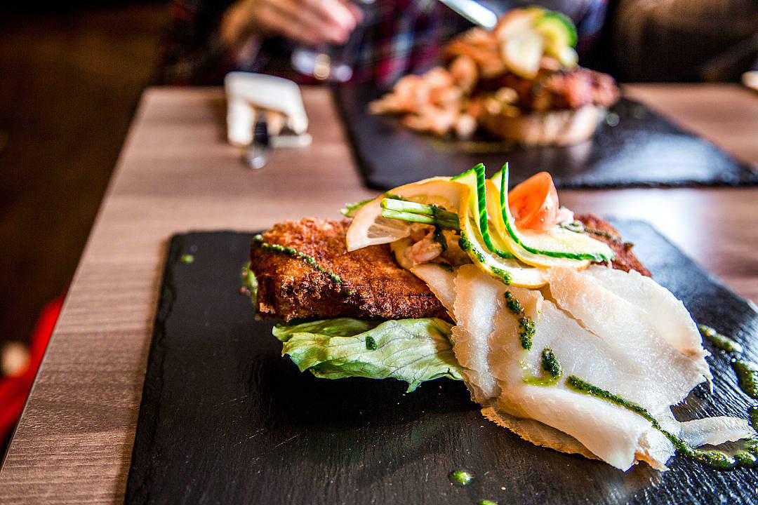 Fish from Greenland served on a bed of lettuce and vegetables.