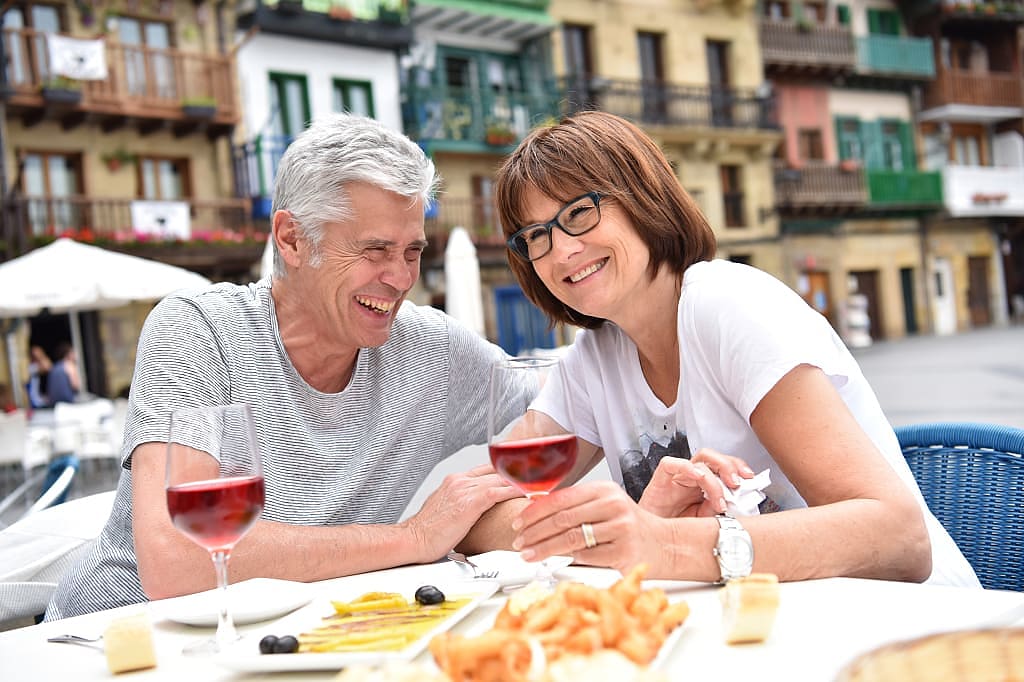 Senior couple dining outside in Spain