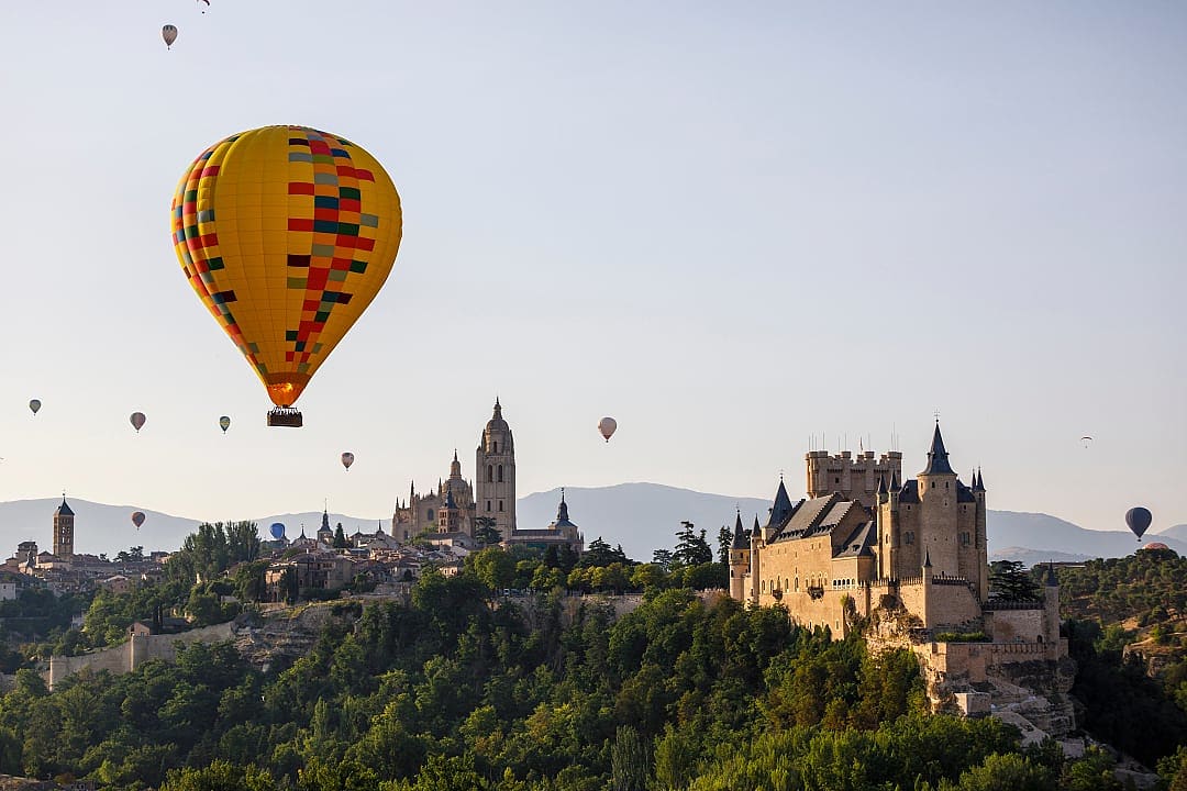 Hot air balloon over The Segovia Castle in Spain