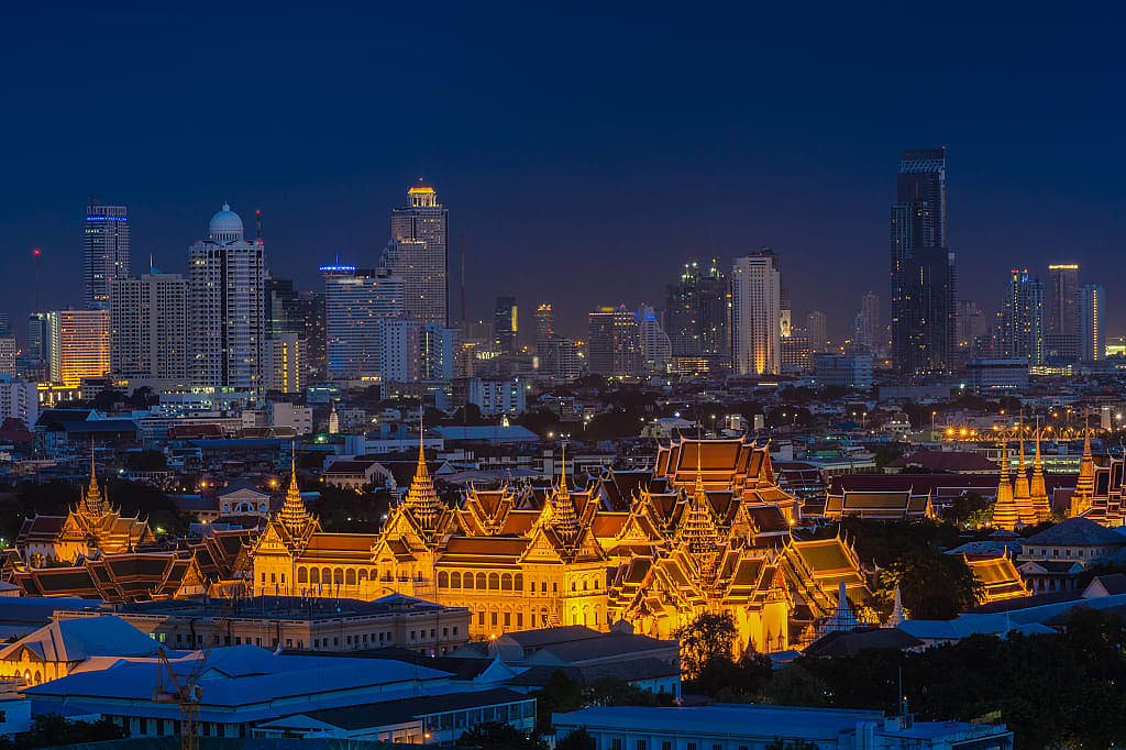 Grand Palace set agains the modern skyline in Bangkok, Thailand