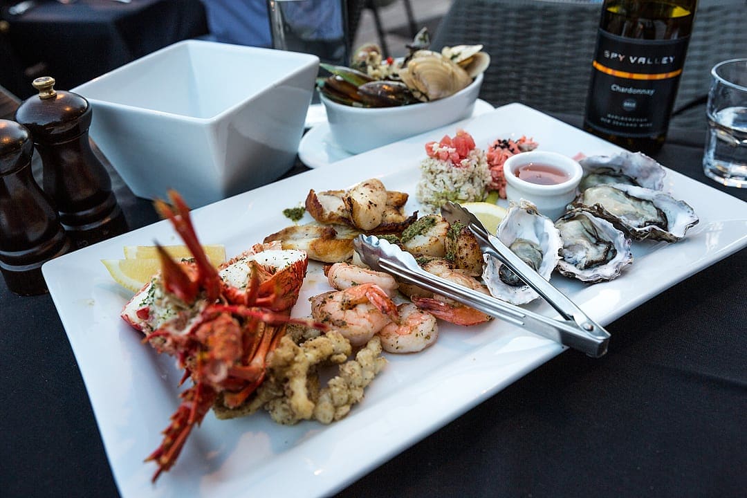 Seafood and wine served at a restaurant in New Zealand