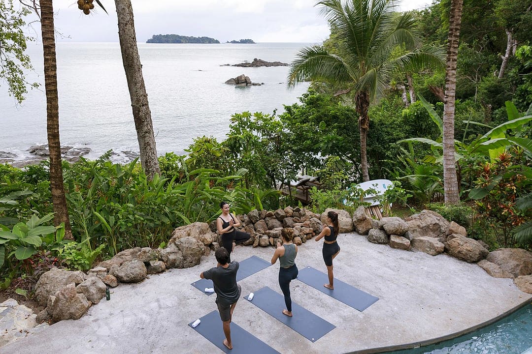 Private yoga lesson in front of the beachfront.