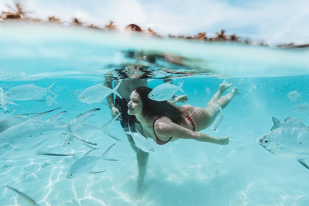 Couple swimming in the Maldives