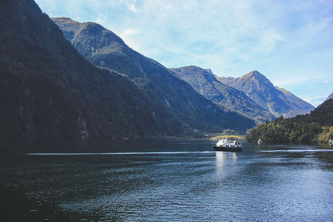 A boat cruises the "Sound of Silence," New Zealand.
