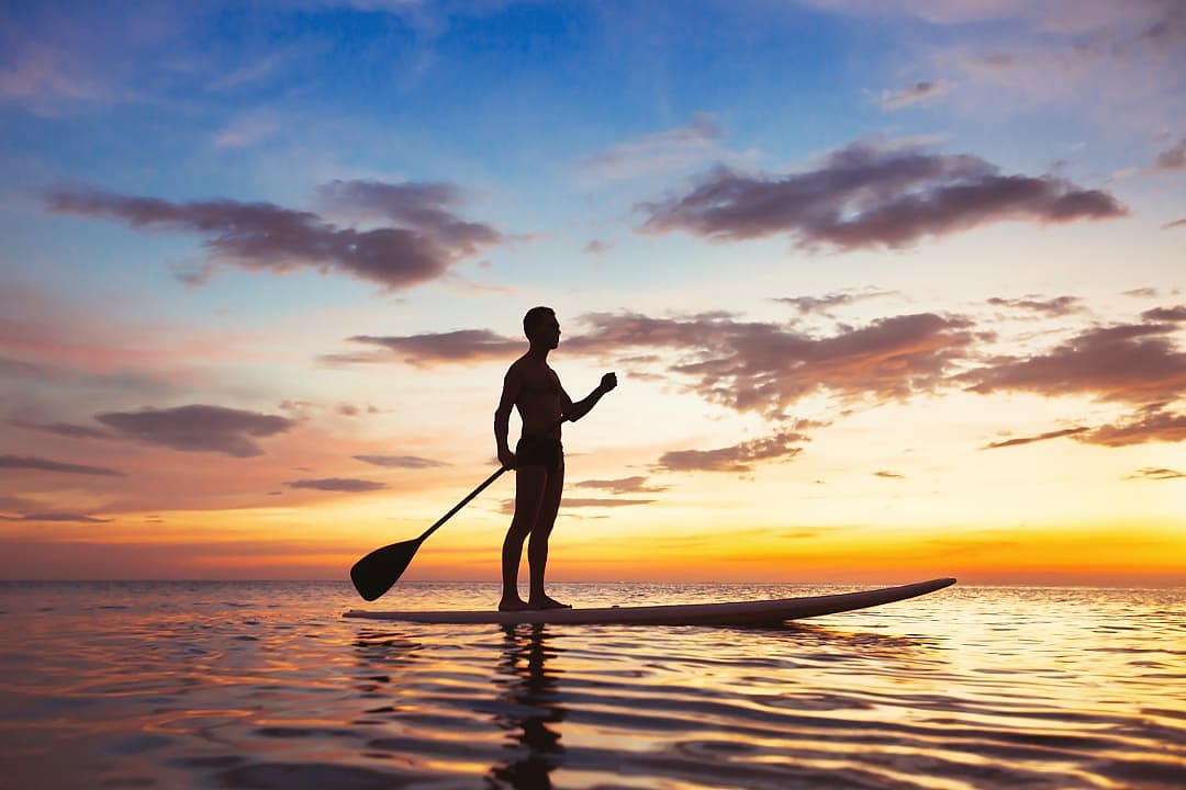 Paddle boarding on Taapuna waters in Tahiti